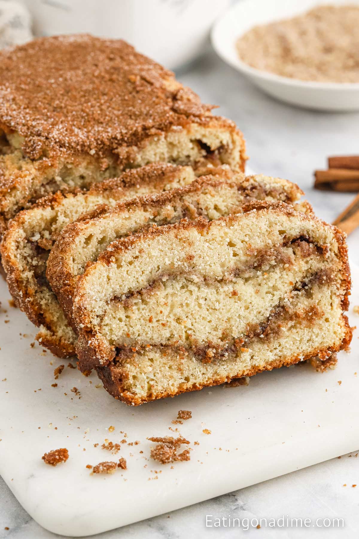 Slice snickerdoodle bread on a cutting board