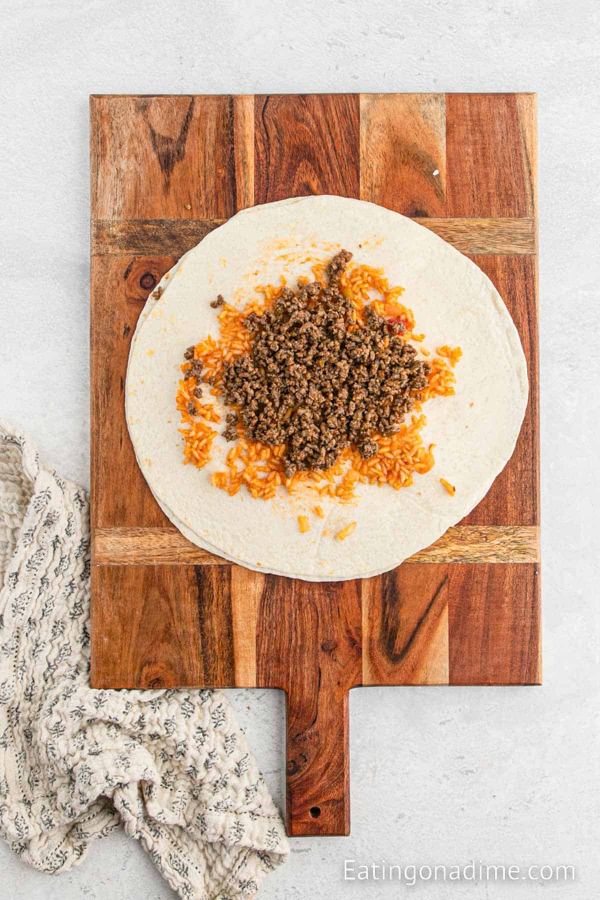 Ground beef and rice topped on tortilla