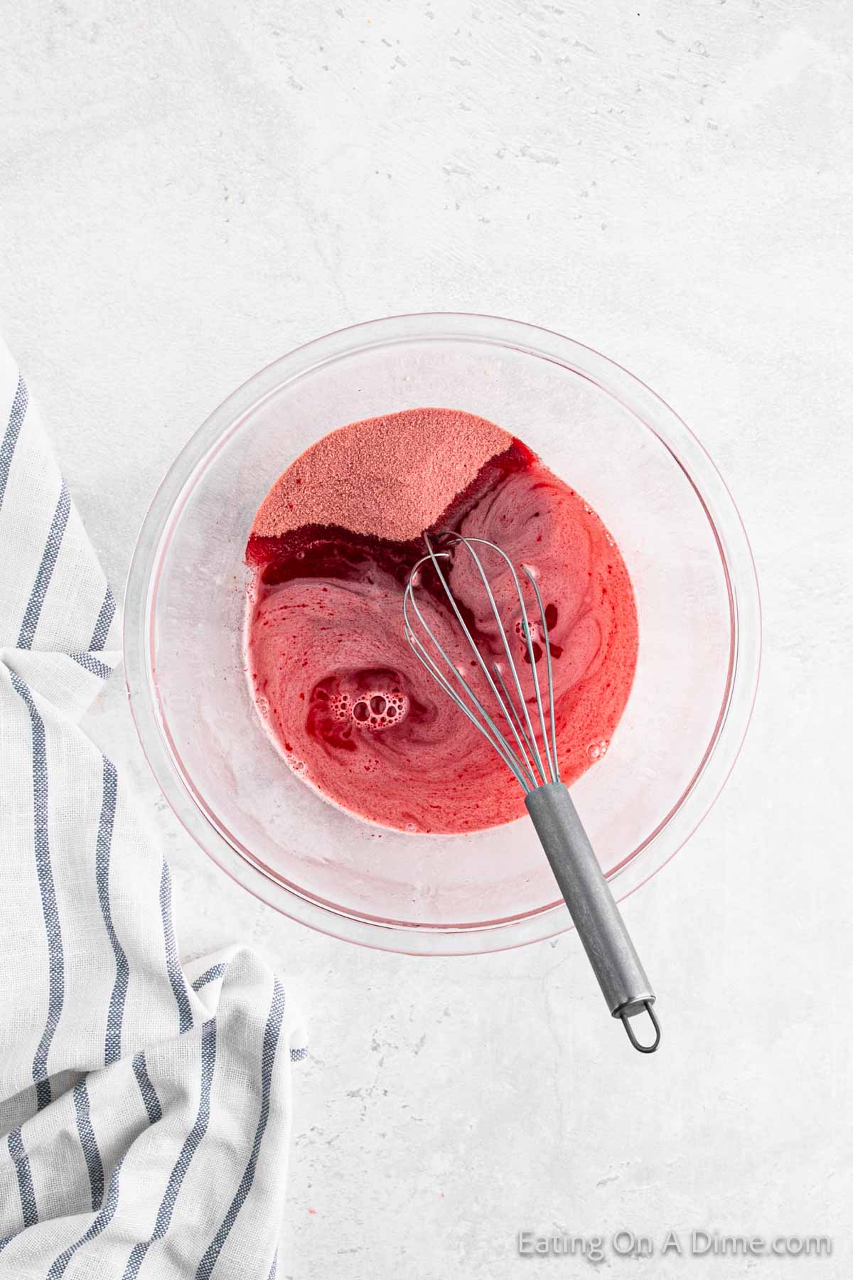 Red Jello in a bowl mixed with water