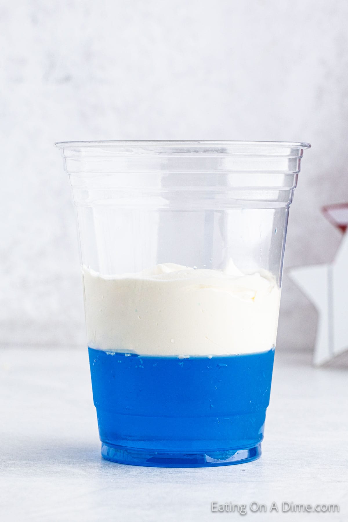 Top the jello with cool whip in clear cup