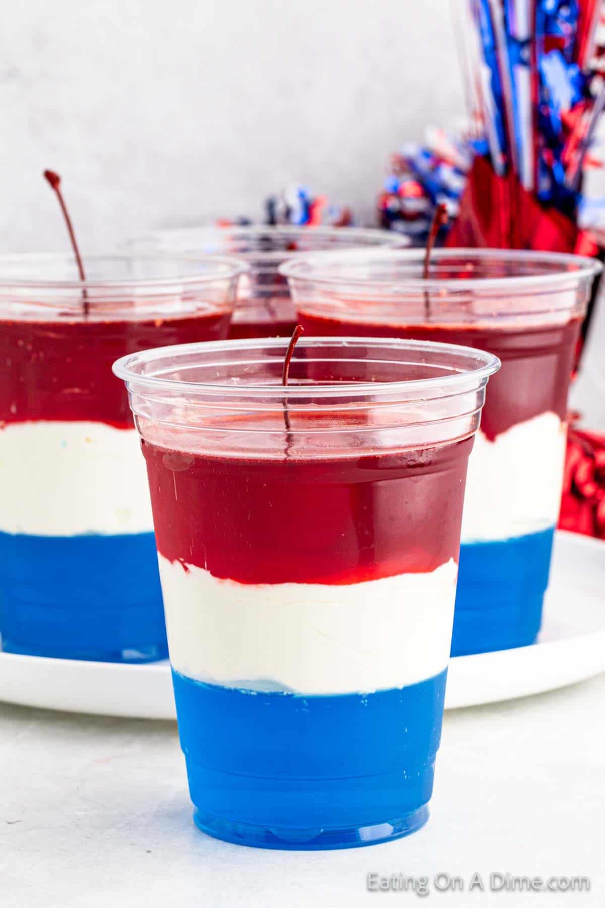 Red white and blue jello in a clear cup