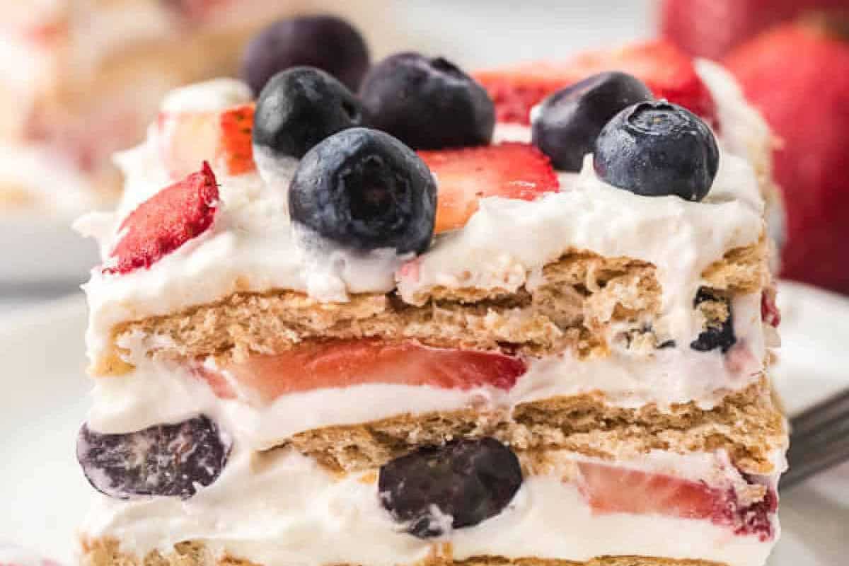 Slice of Red White and Blue Icebox Cake on a plate.