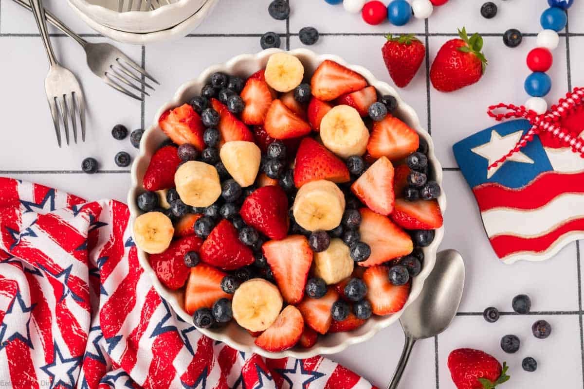 Fruit salad with strawberries, bananas, and blueberries in a bowl