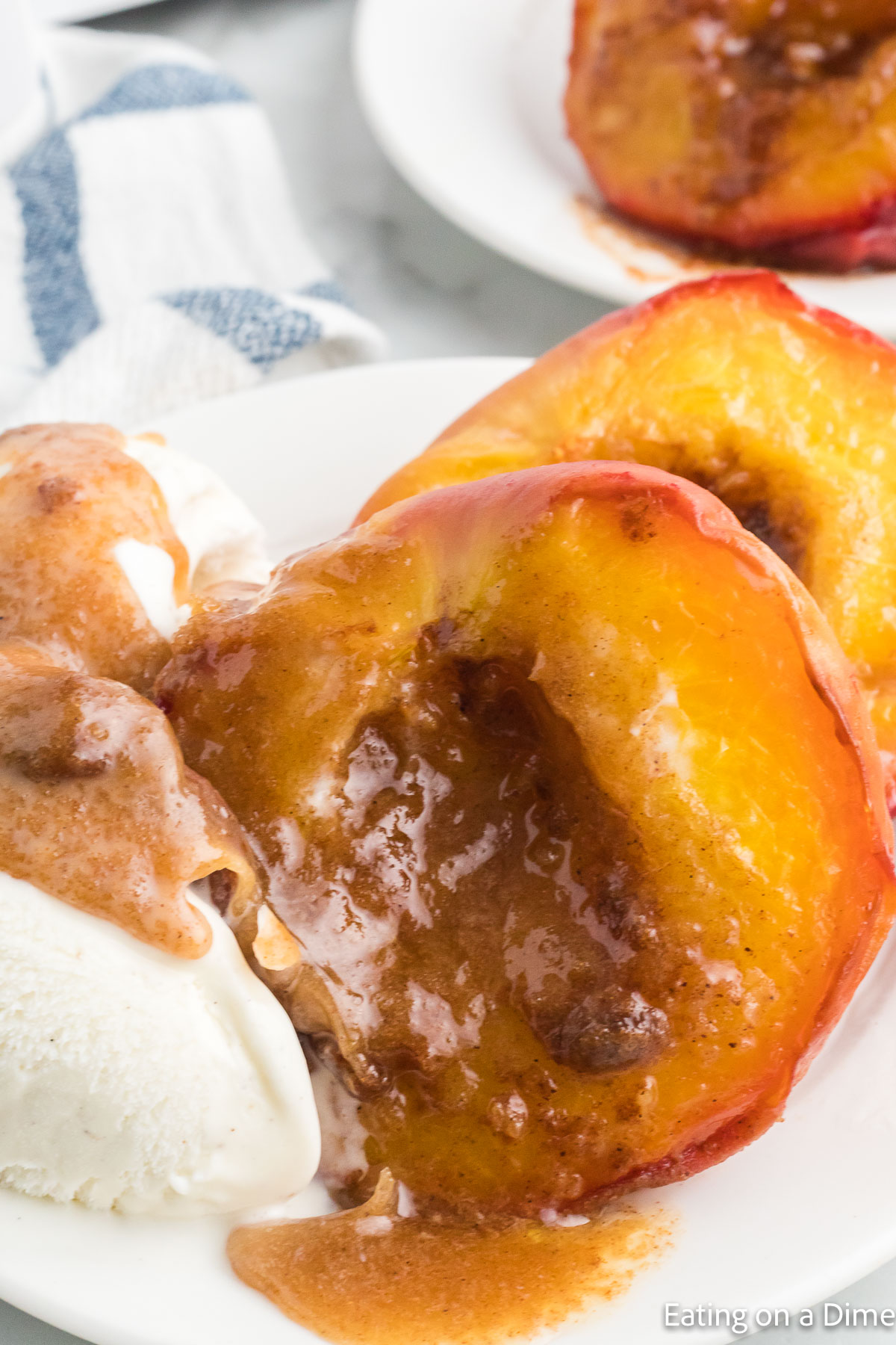 Air Fryer Peaches on a platter with ice cream