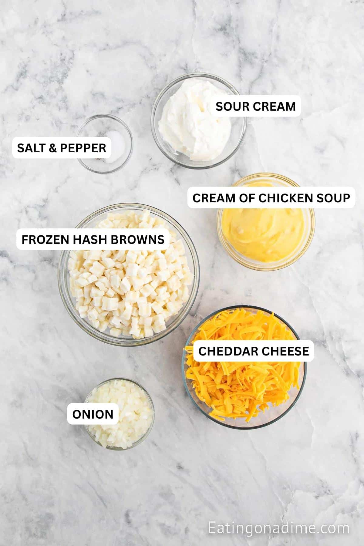 Ingredients for recipe: cream of chicken soup, hash browns, cheddar cheese, onion, salt, pepper and sour cream.