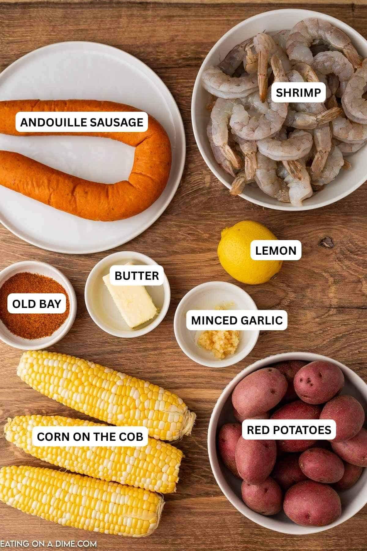 Ingredients for recipe: andouille sausage, shrimp, lemon, butter, old bay, minced garlic, corn on the cob and red potatoes.