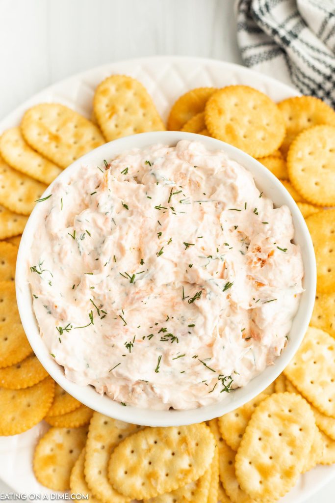 Smoked Salmon dip served in a bowl with a platter of crackers