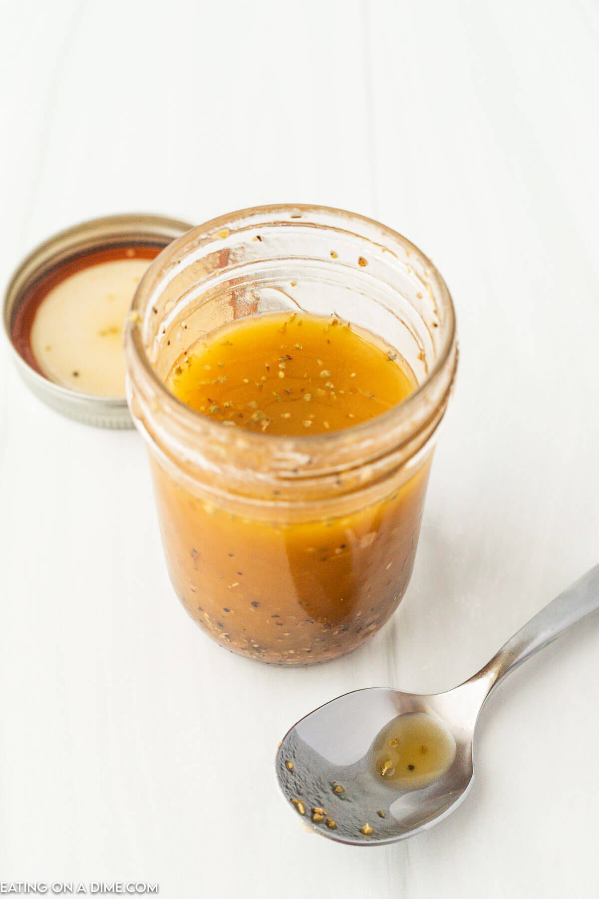 Mixing the dressing together in a jar