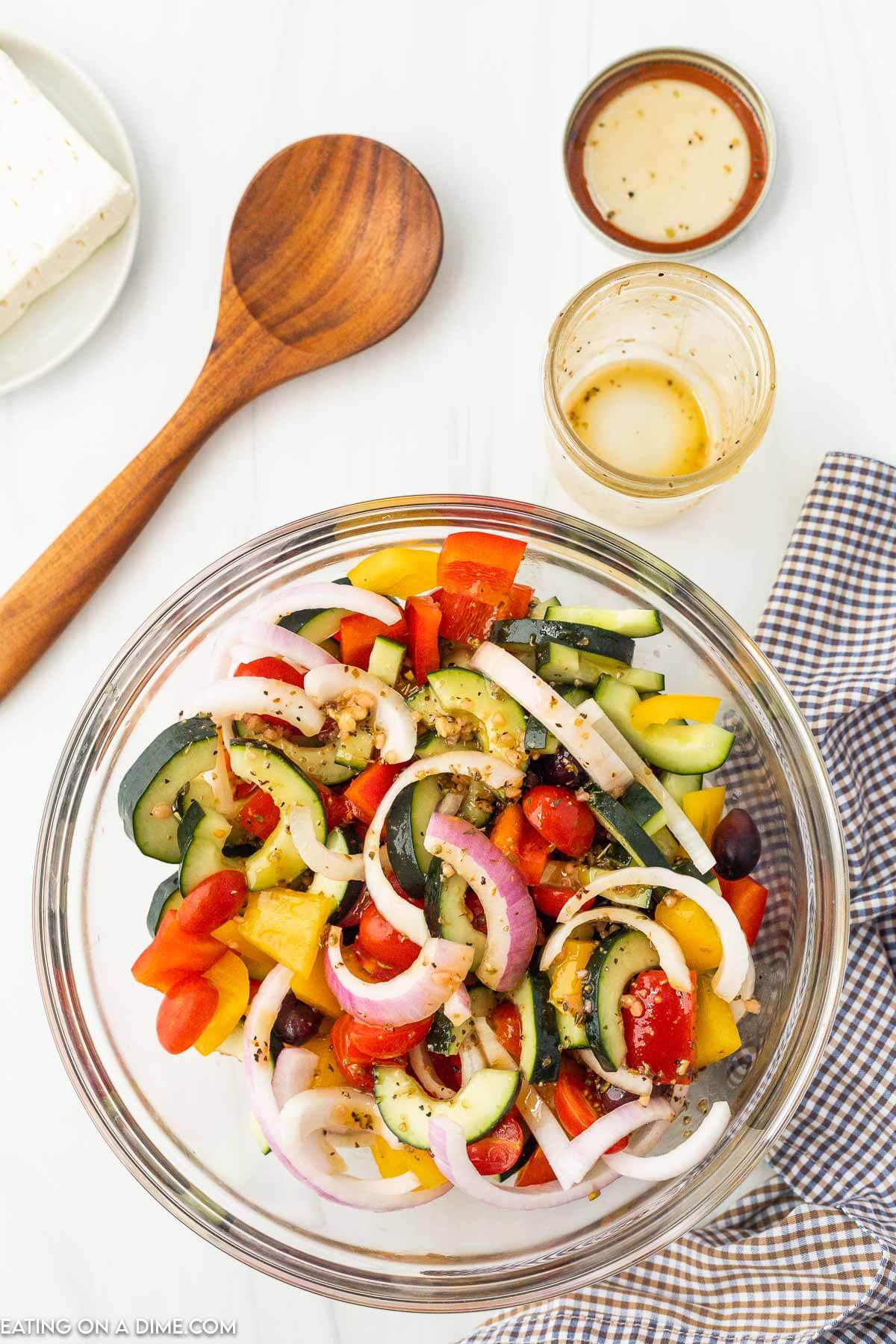 Mixing dressing and salad ingredients together