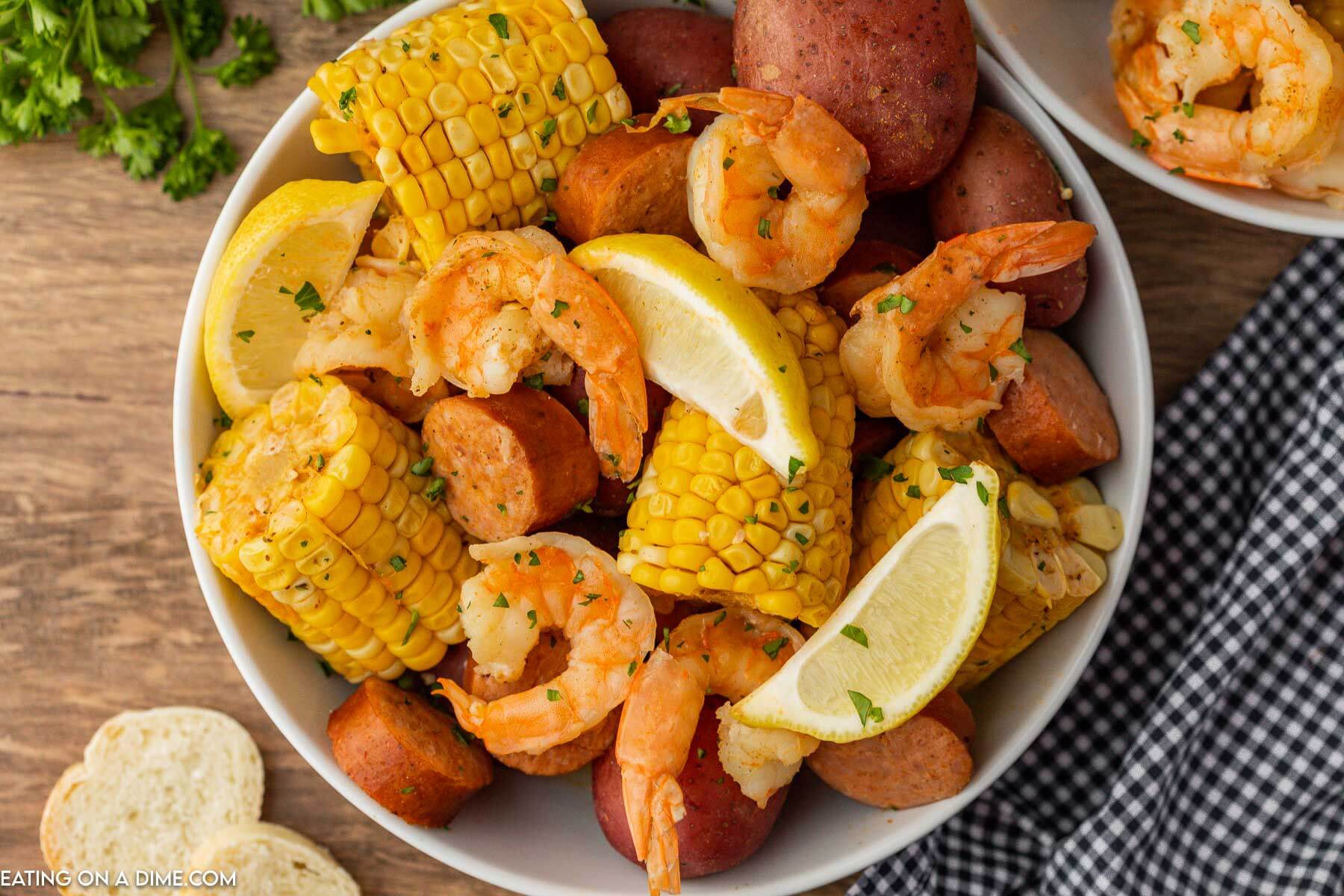 Shrimp boil in a white bowl