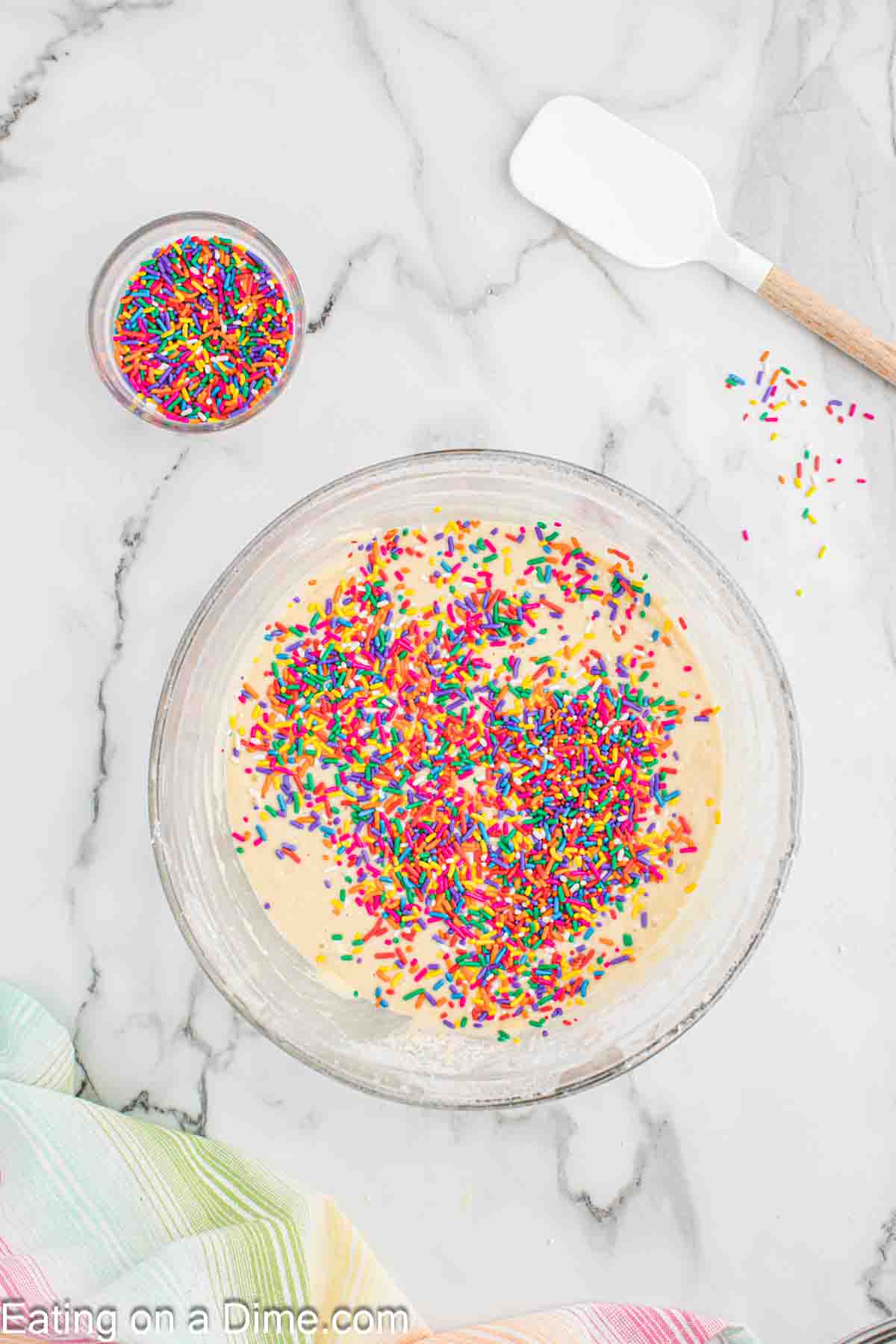 Mixing in sprinkles to the cake batter