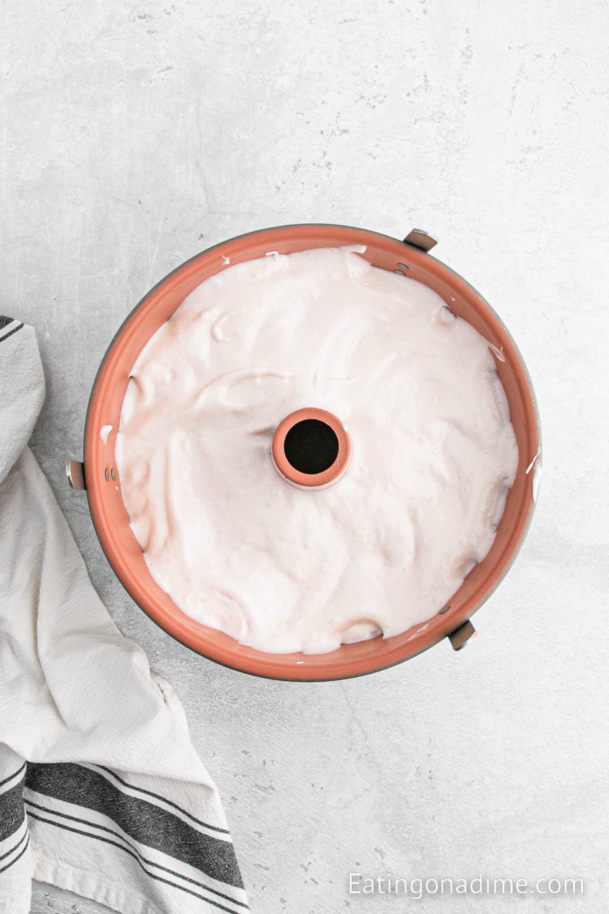 Pour the angel food cake batter into tub pan
