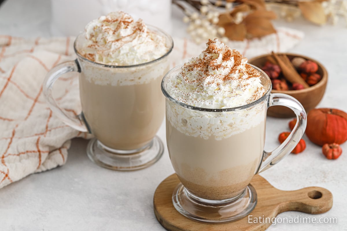 Pumpkin Spice Latte topped with whipped cream and seasoning