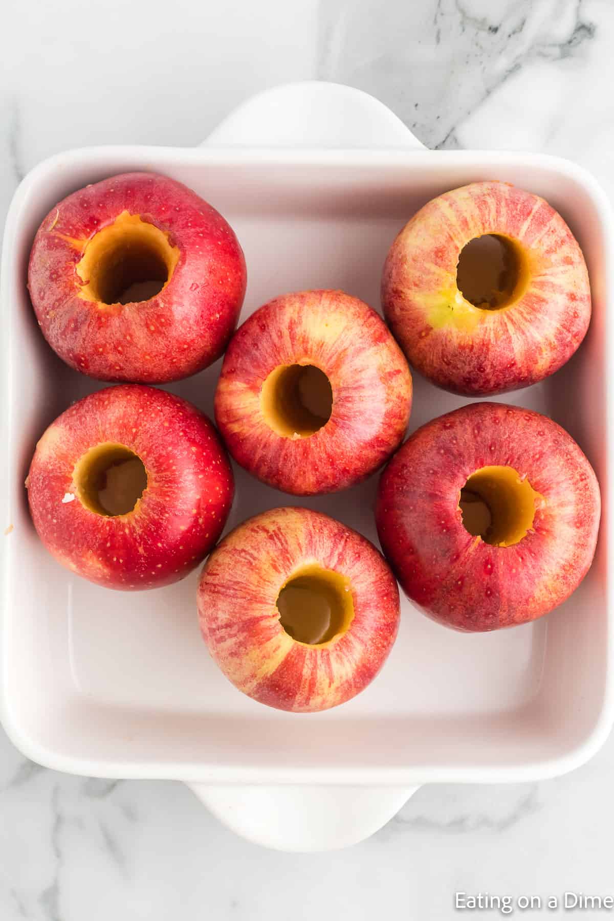 Placed core apples in a baking dish