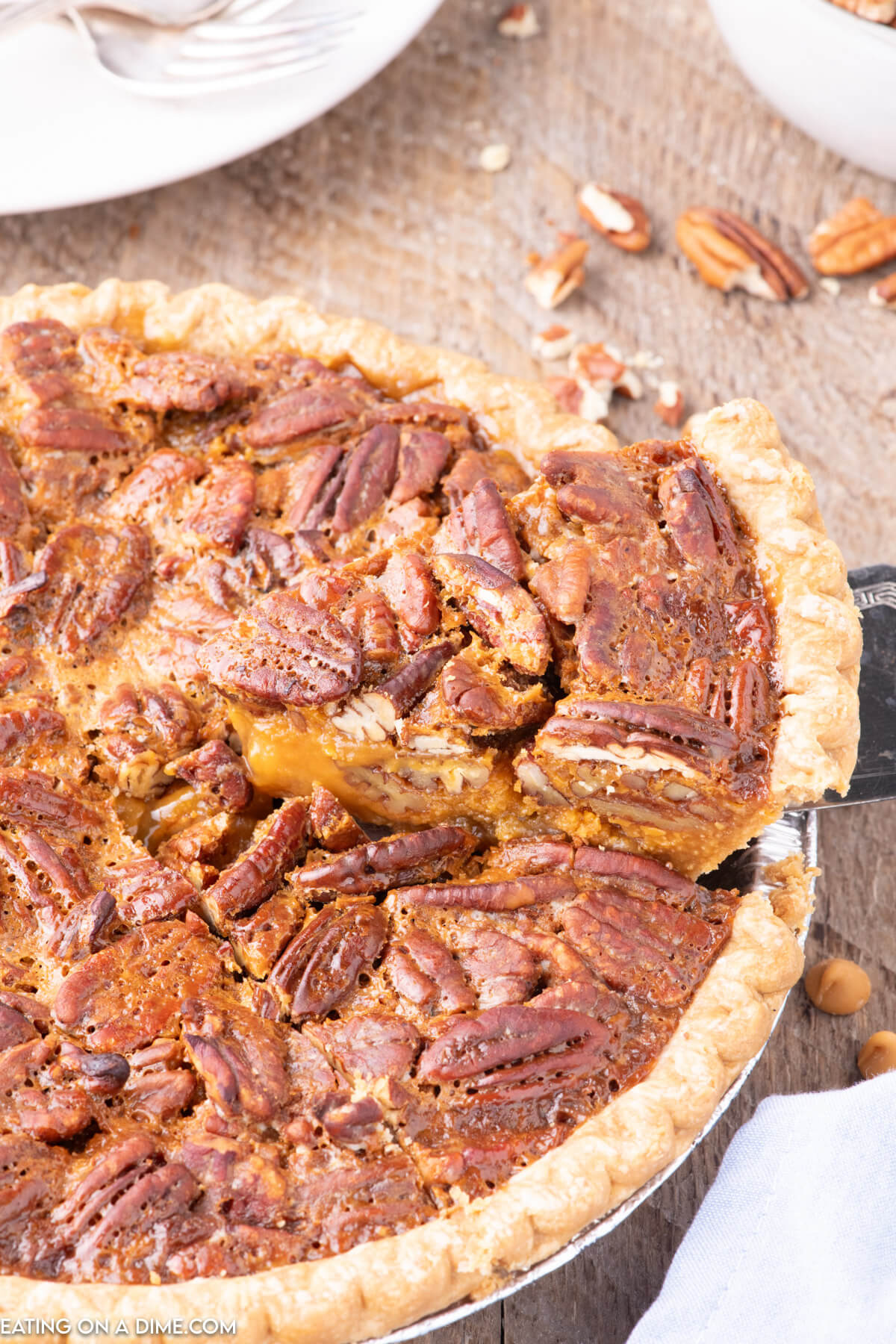 Close up image of a whole butterscotch pecan pie