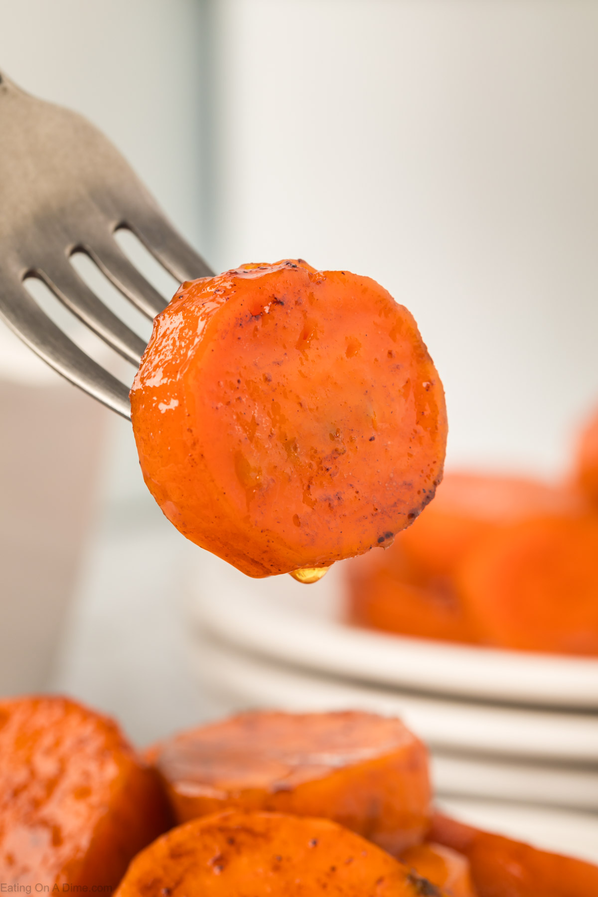 Close up candied yams on a fork