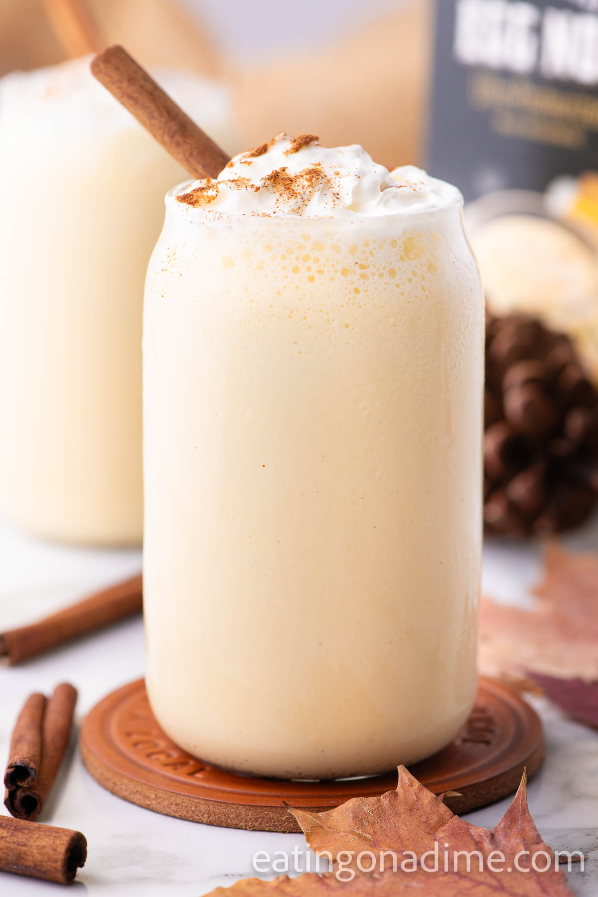 Eggnog Milkshake in a glass with whipped cream. 