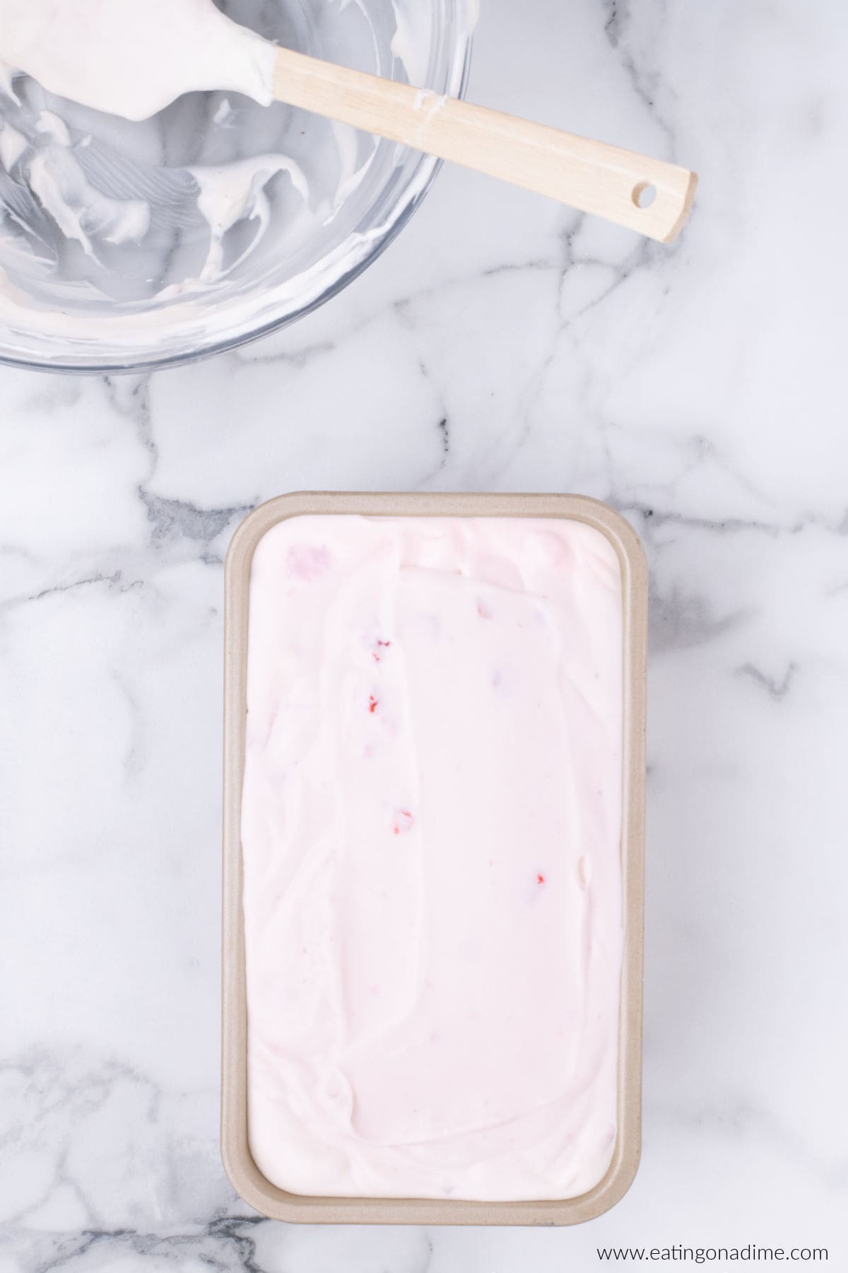 Strawberry mixture added to a loaf pan.