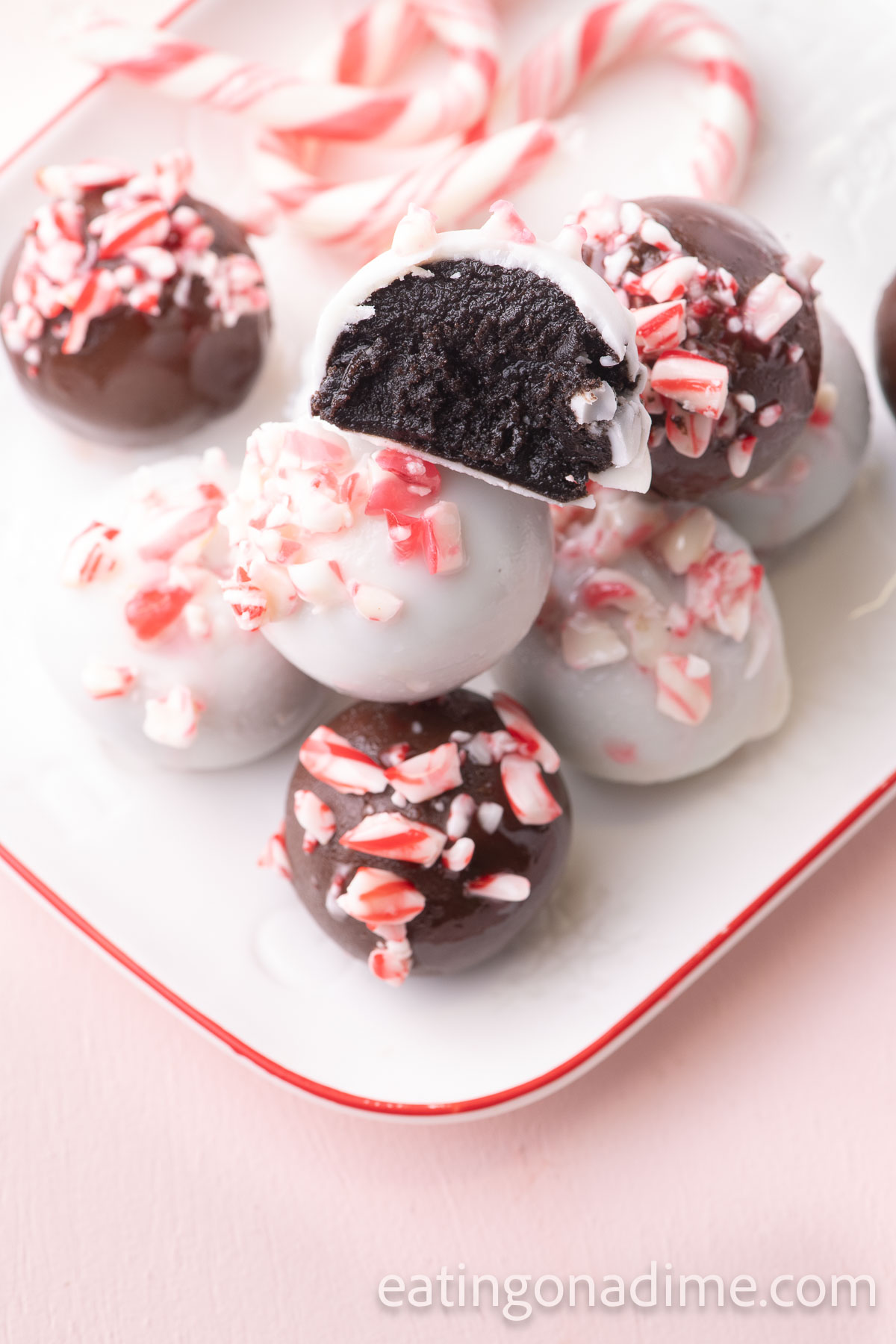 Peppermint Oreo Balls stacked on a platter
