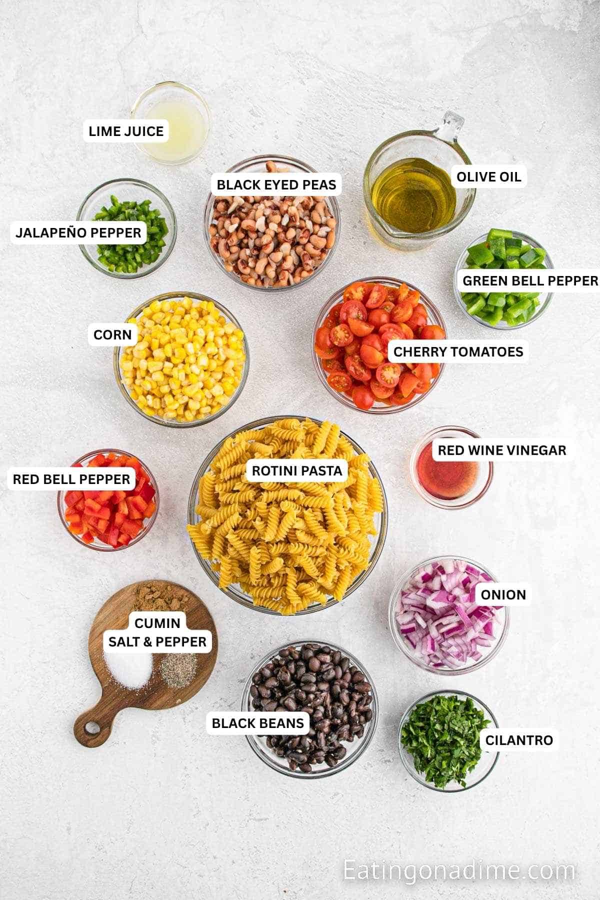 Ingredients for recipe: lime juice, jalapeno pepper, black eyed peas, olive oil, green bell pepper, cherry tomatoes, corn, red wine vinegar, pasta, red bell pepper, cumin, salt, pepper, black beans, onion and cilantro.