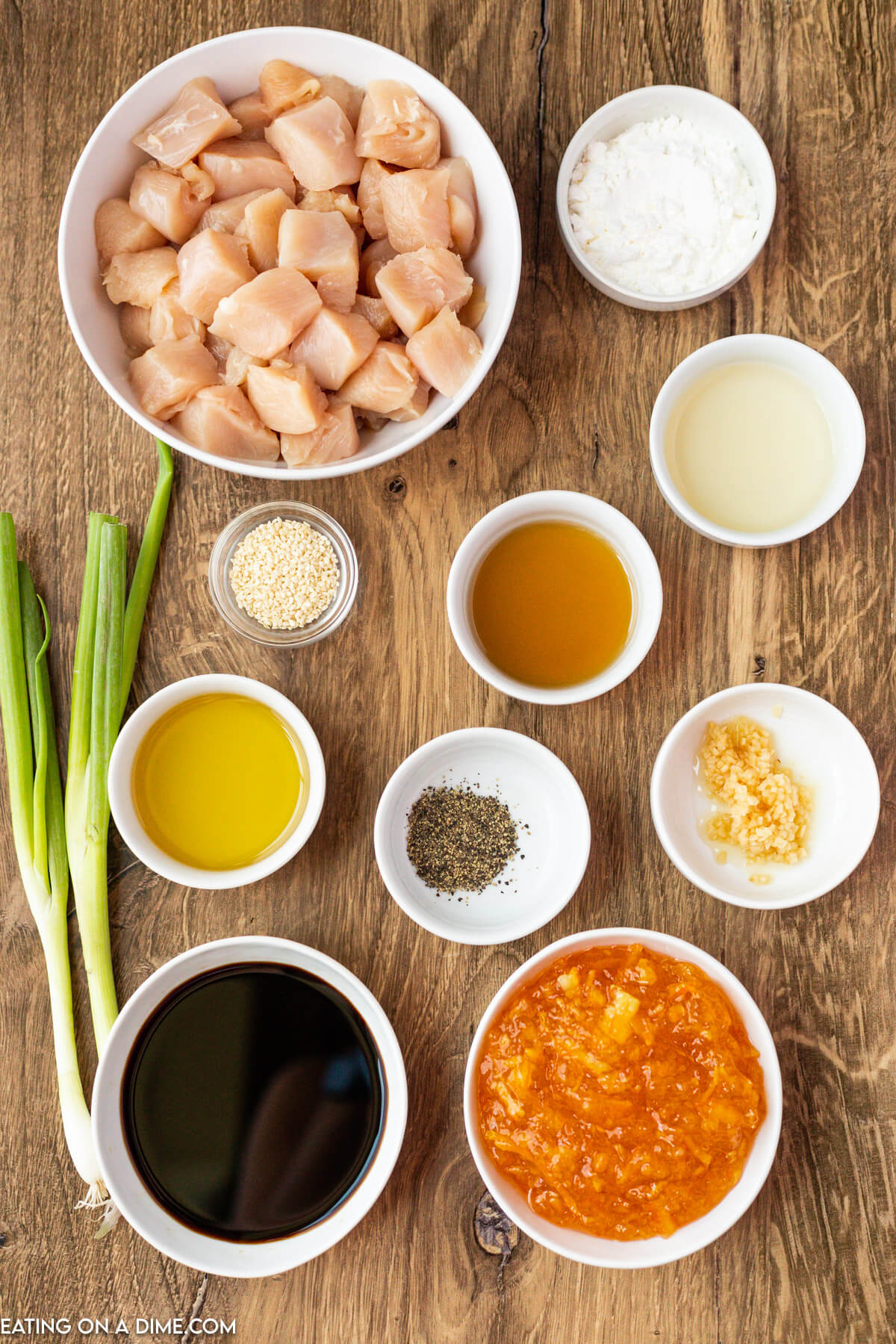 Chicken breasts, cornstarch, pepper, marmalade, soy sauce, rice vinegar, sesame oil, garlic, sesame seeds, green onions