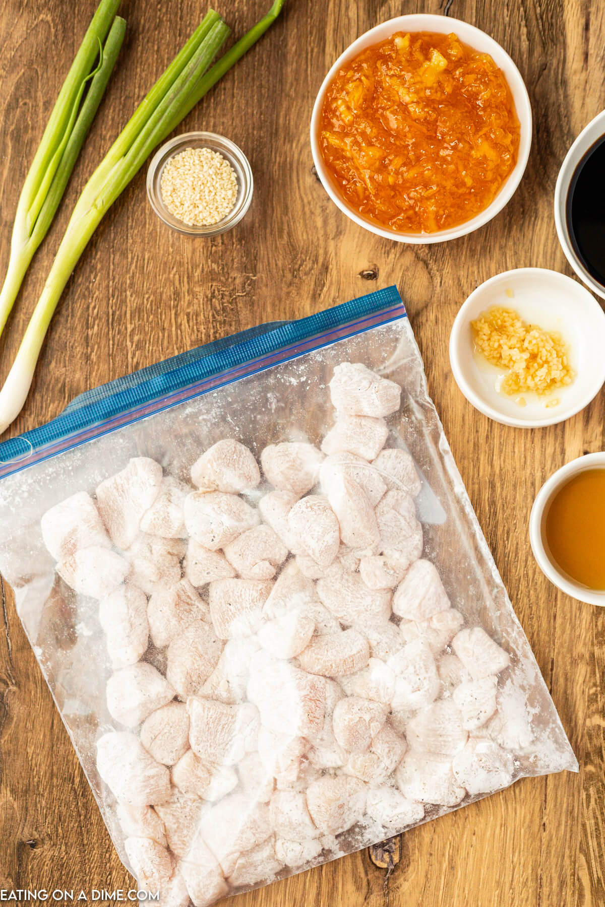 Placing the diced chicken in a zip lock bag and covering with cornstarch