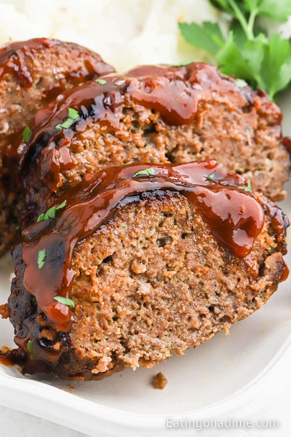 Slice meatloaf on a plate with mashed potatoes