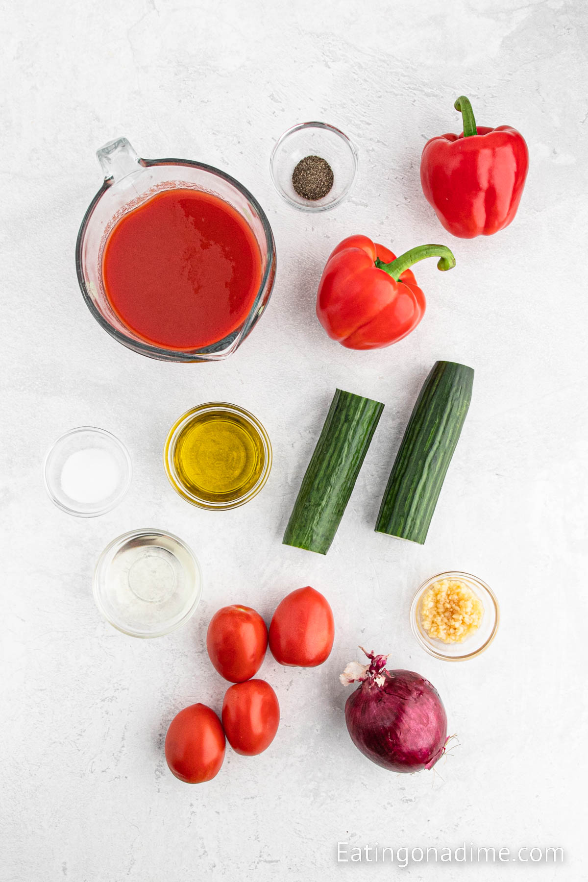 English Cucumber, bell pepper, tomatoes, red onion, garlic, tomato juice, vinegar, olive oil, salt, pepper