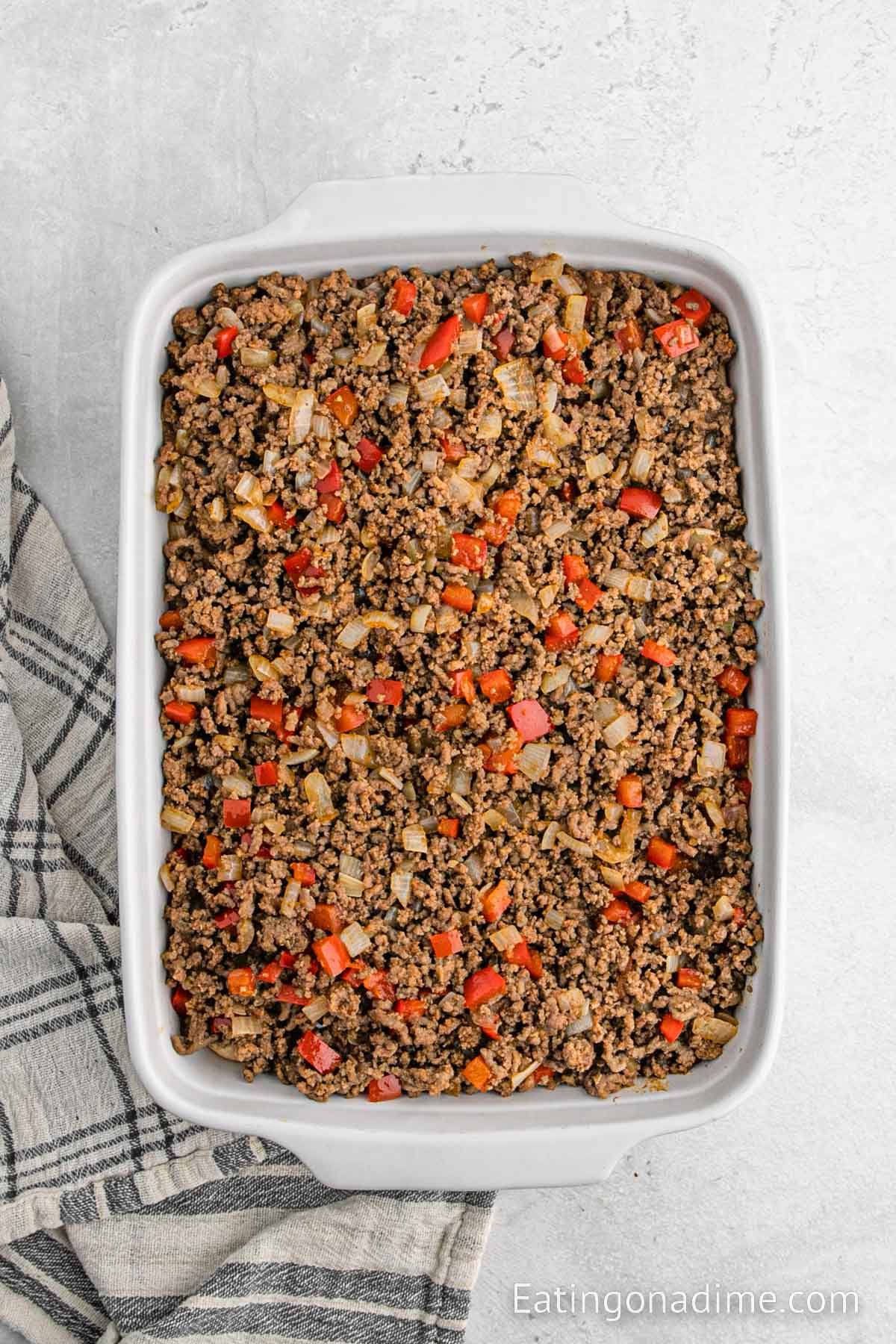 Layering on the biscuits in the baking dish