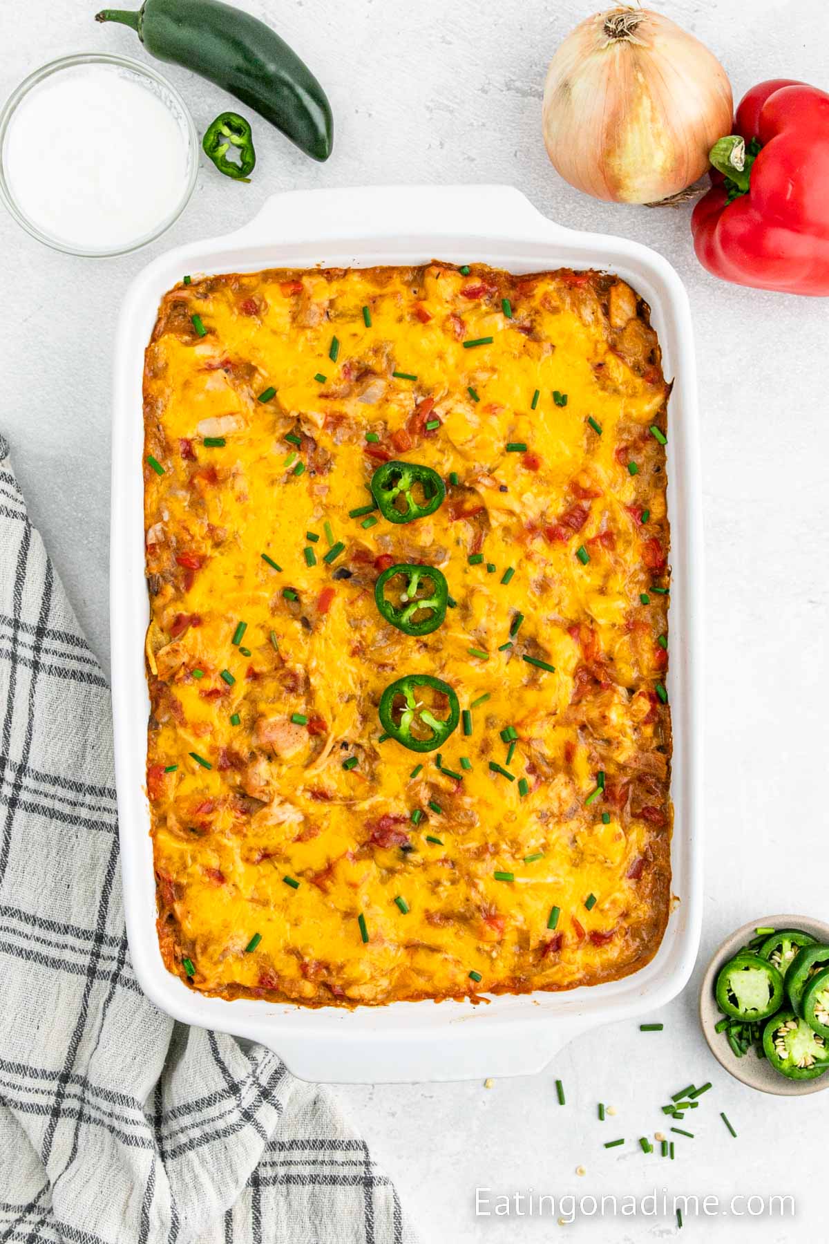 King Ranch Chicken Casserole in a baking dish topped with slice jalapenos