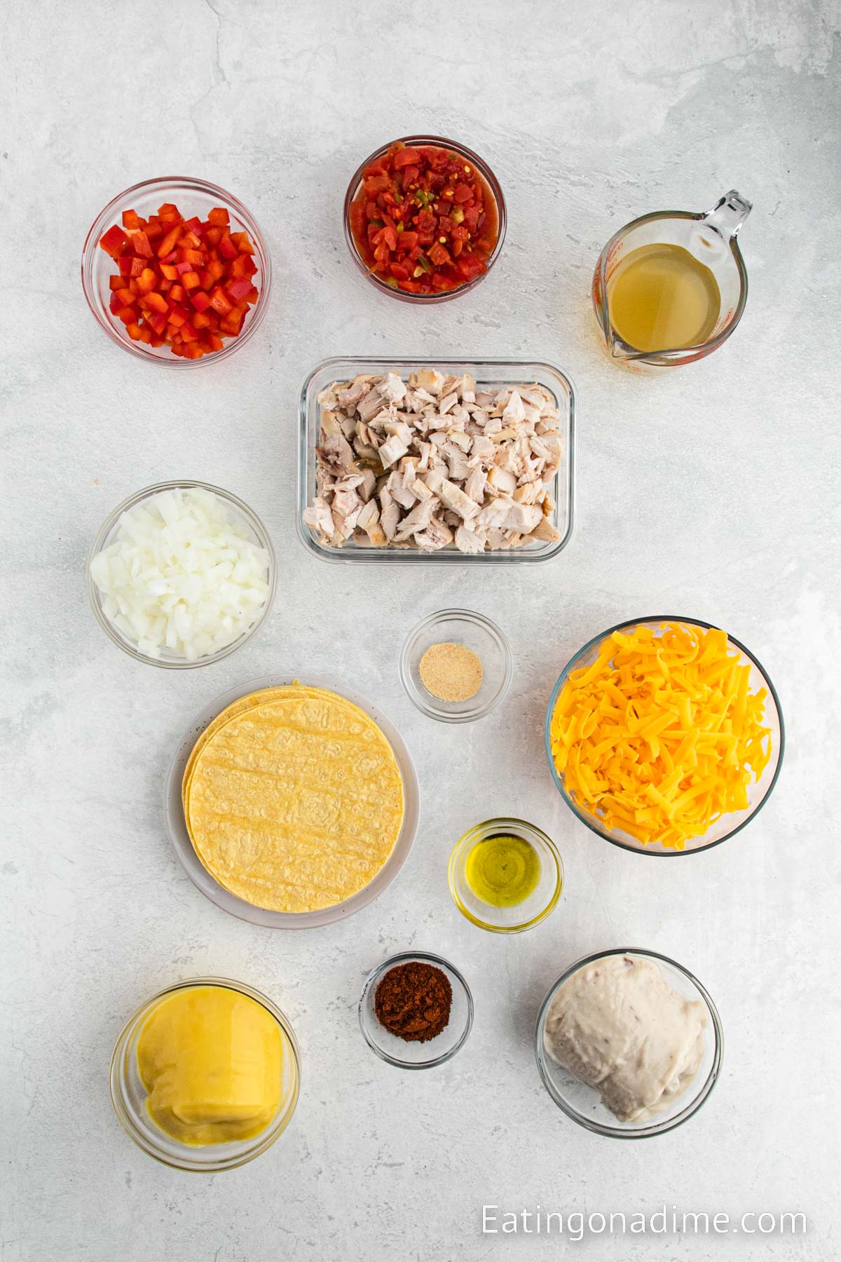 Ingredients needed for King Ranch Chicken Casserole - Olive oil, onion, bell pepper, cream of mushroom soup, cream of chicken soup, diced tomatoes with green chilies, chicken broth, chili powder, garlic powder, shredded chicken, corn tortillas, cheddar cheese