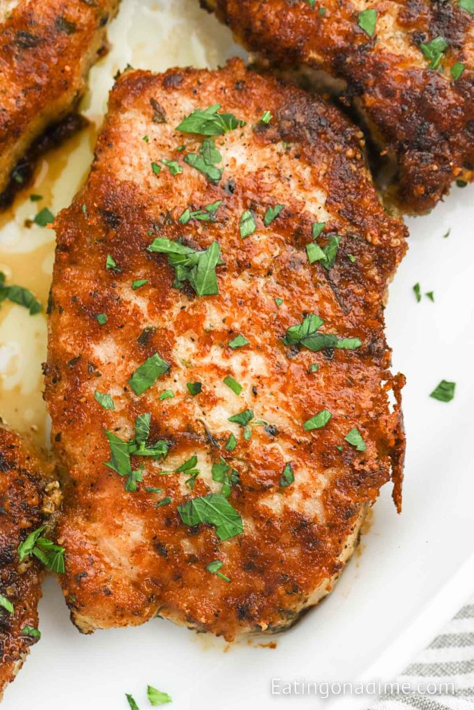 Parmesan Crusted Pork Chops in a baking dish
