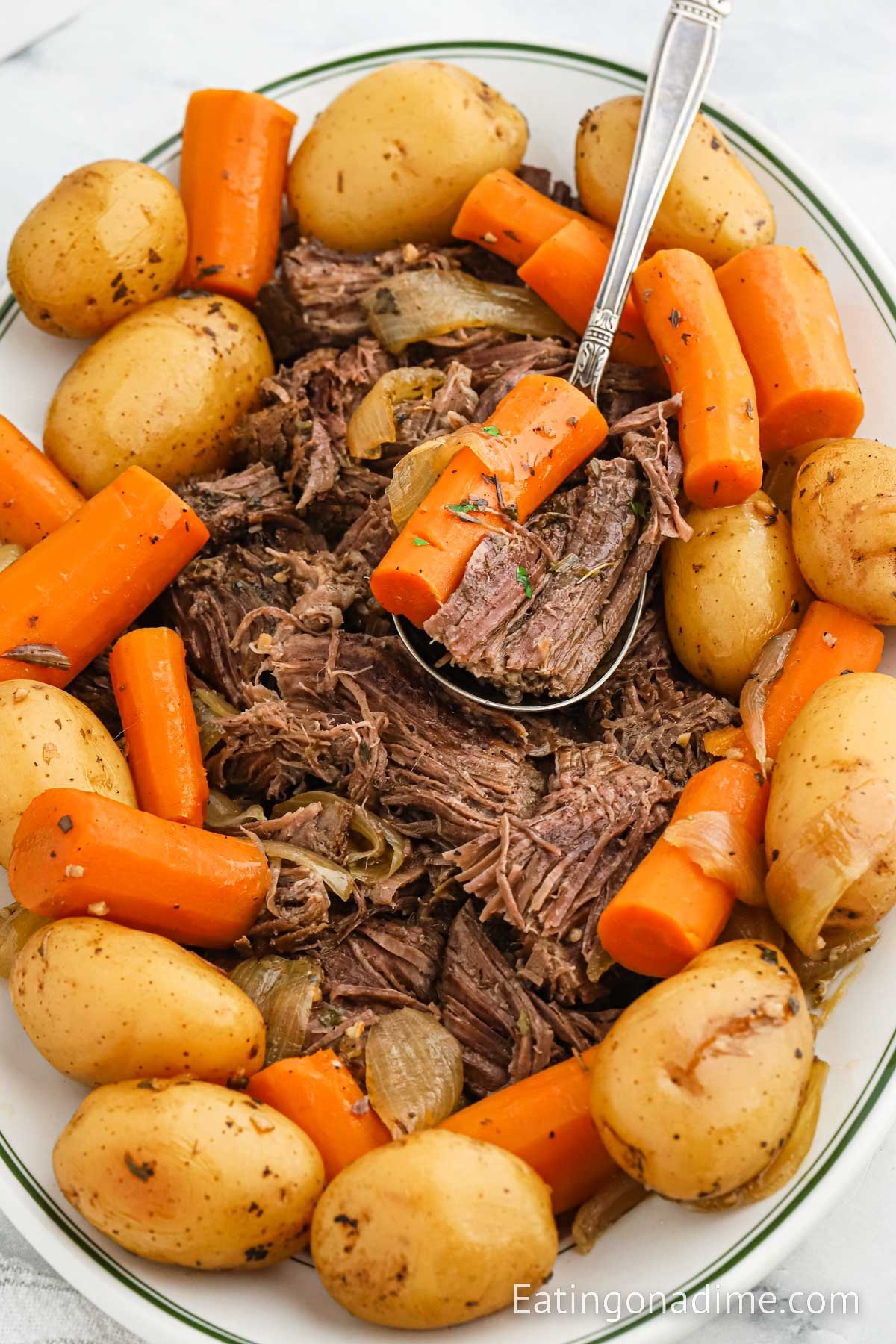 Pot Roast with carrots and potatoes on a serving platter