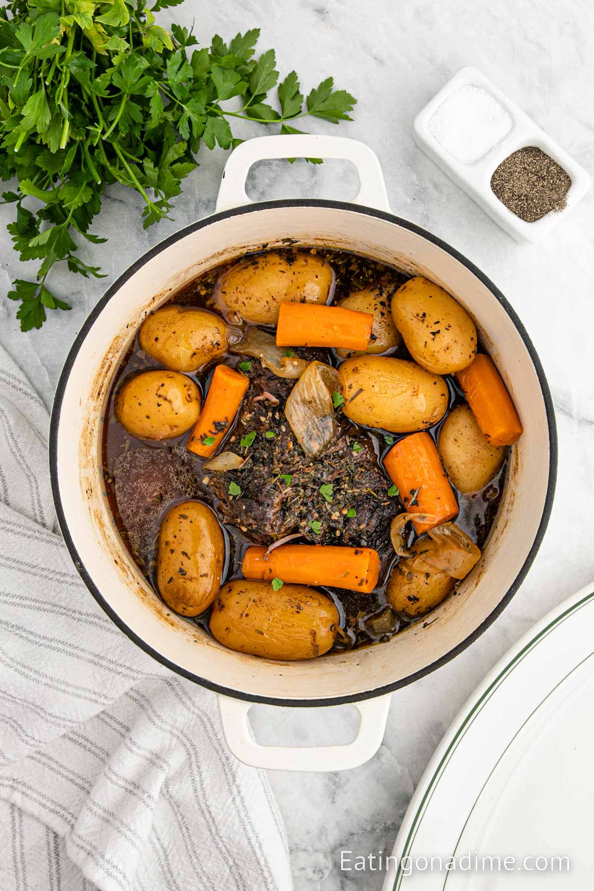Pot Roast with carrots and potatoes in a Dutch Oven