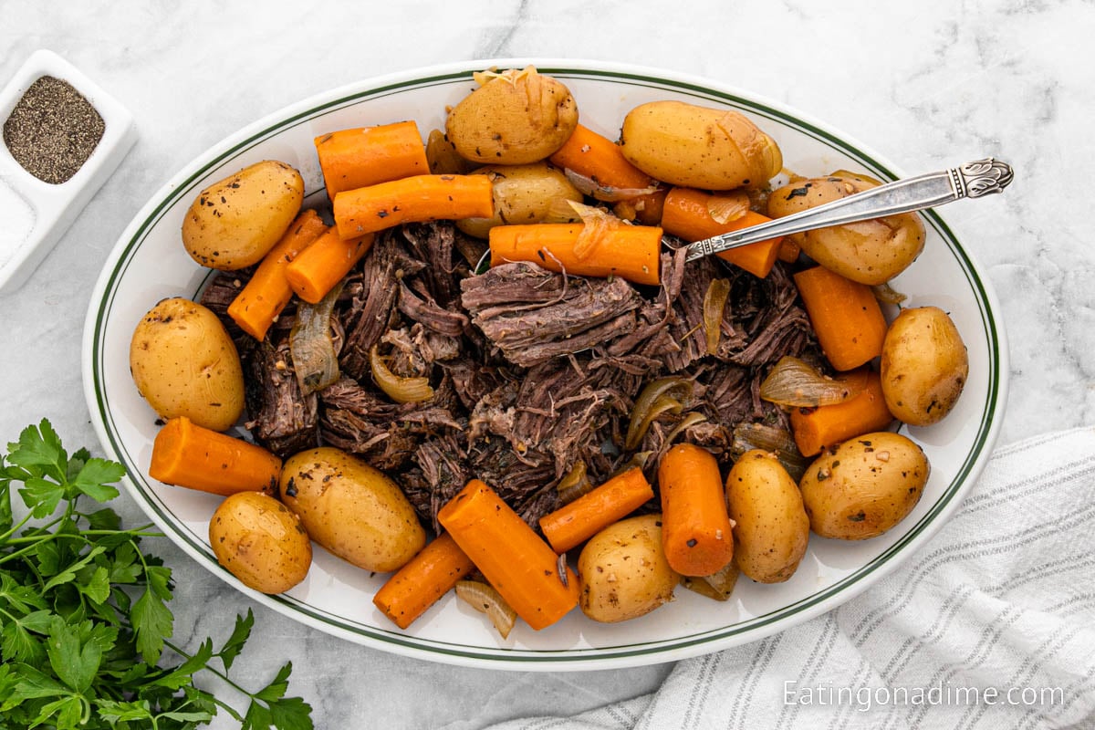 Pot Roast with carrots and potatoes on a serving platter