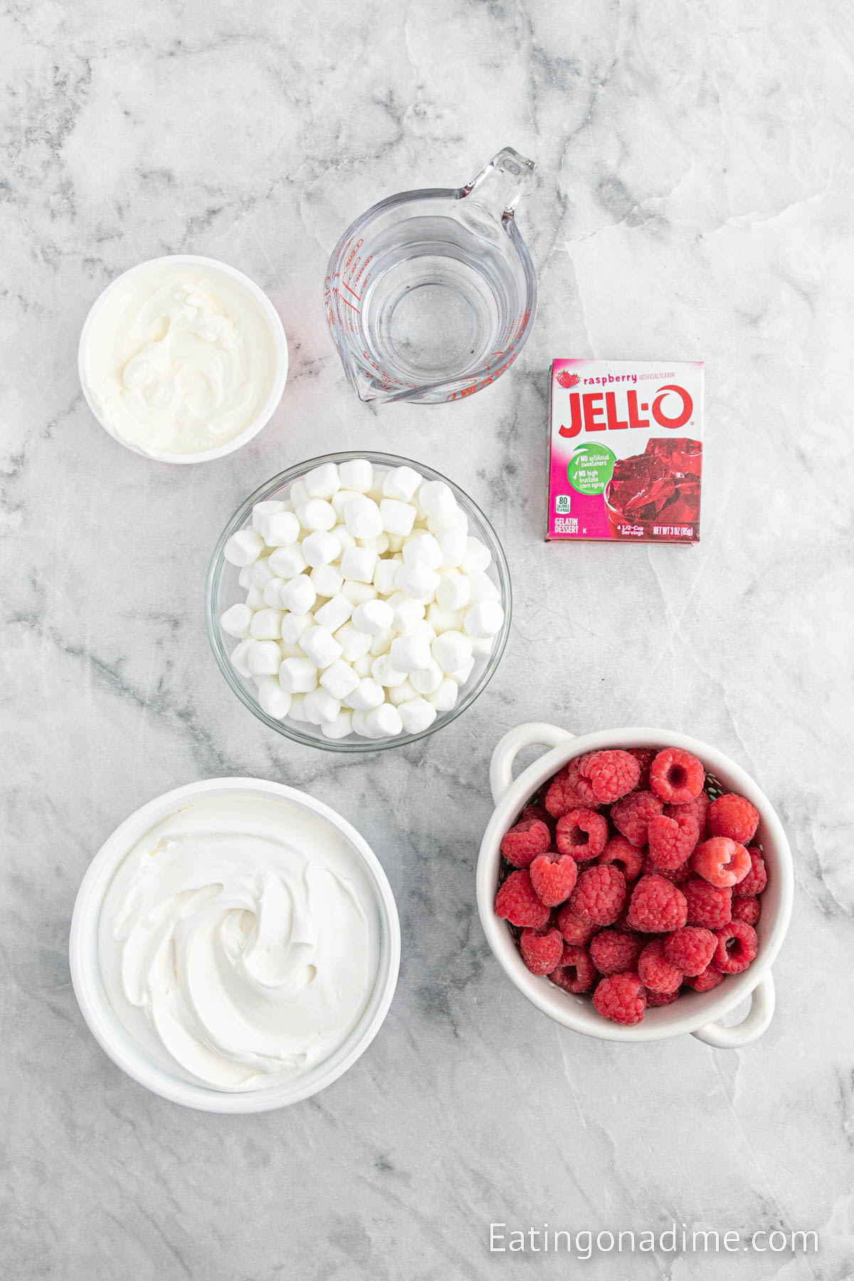 Ingredients needed - raspberry jello mix, water, sour cream, cool whip, raspberries, mini marshmallows