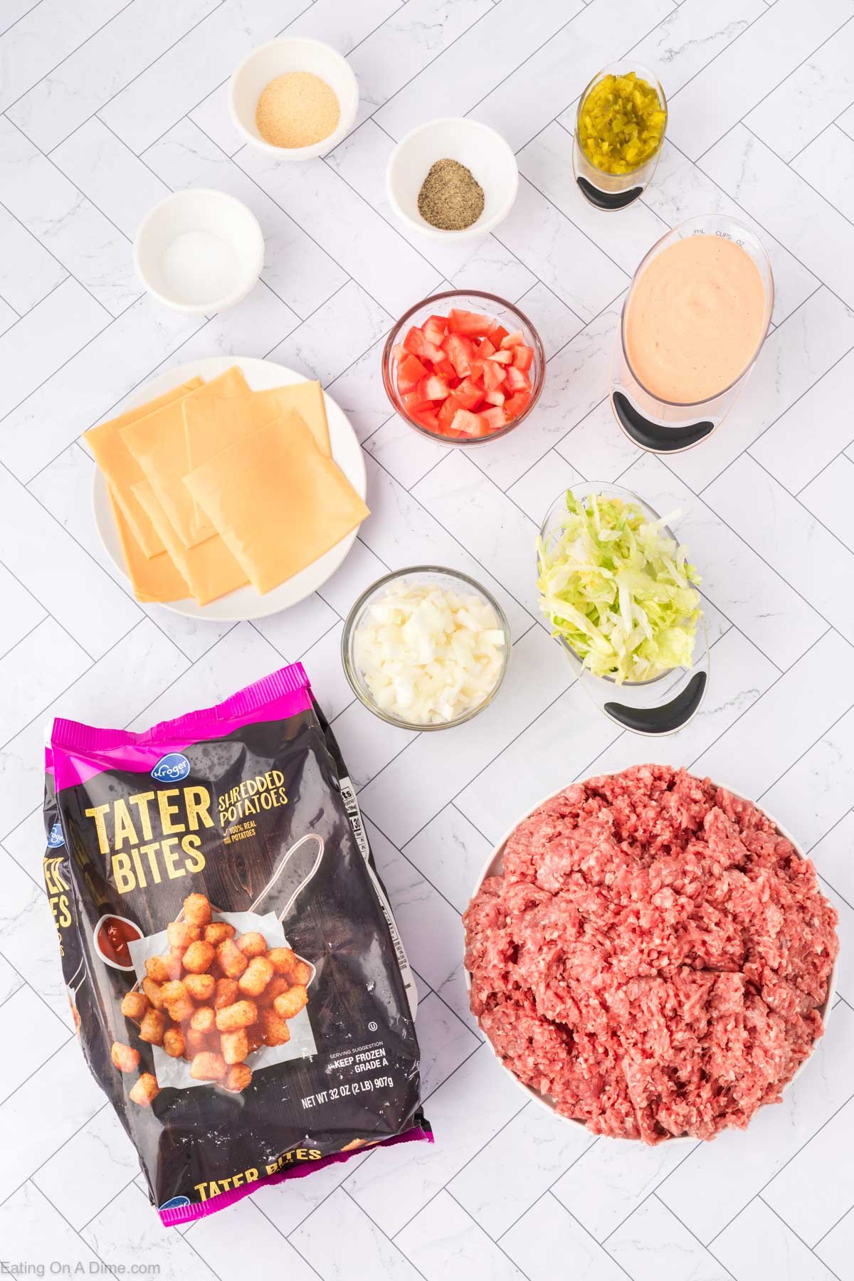 Ingredients needed for big mac tater tot casserole - Lean Ground Beef, big mac sauce, onion, pickles, garlic powder, salt, pepper, American Cheese, tater tots, lettuce, tomatoes