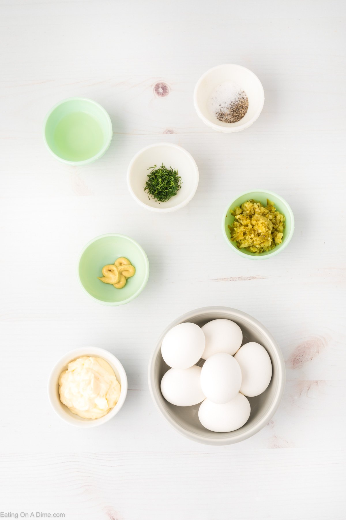 Ingredients needed for Dill pickle deviled eggs, hard boiled eggs, mayo, fresh dill, dijon mustard, dill pickle, salt and pepper