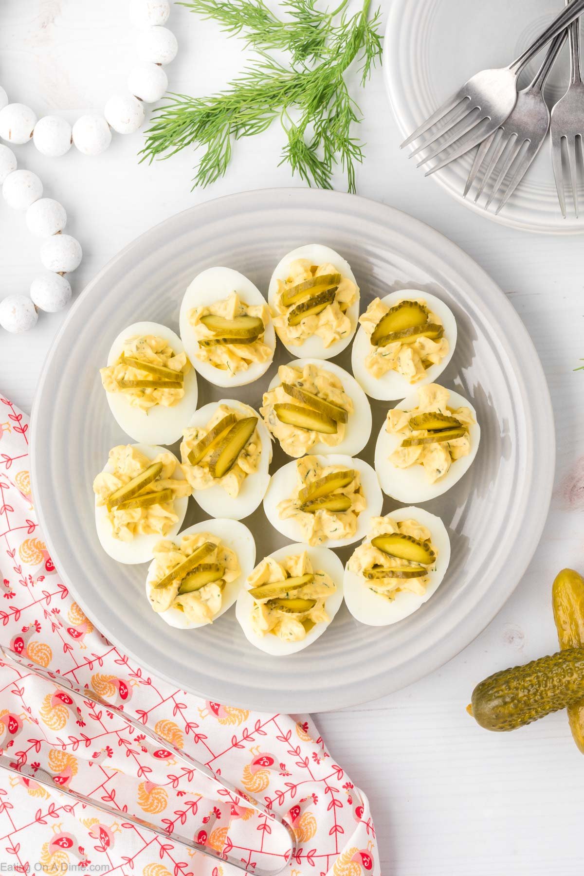 Dill pickle hard boiled eggs on a platter