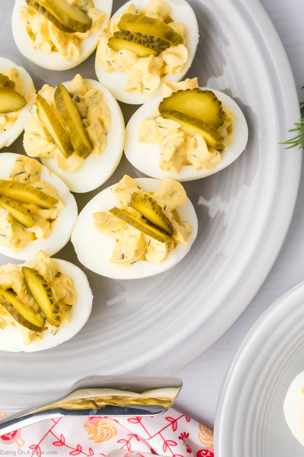 Close up image of dill pickle deviled eggs on a platter