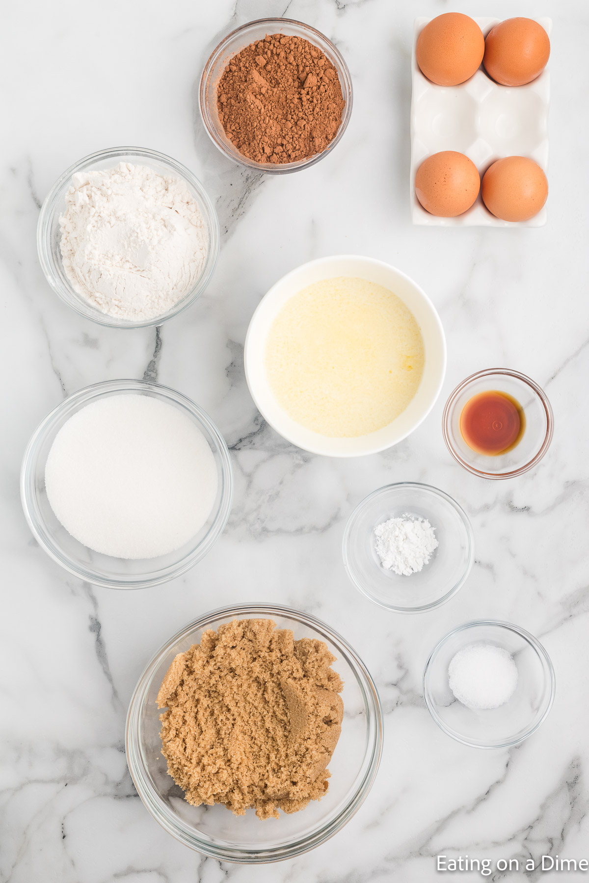 Sugar, brown sugar, cocoa powder, flour, salt, baking powder, eggs, butter, vanilla extract, white decorating gel