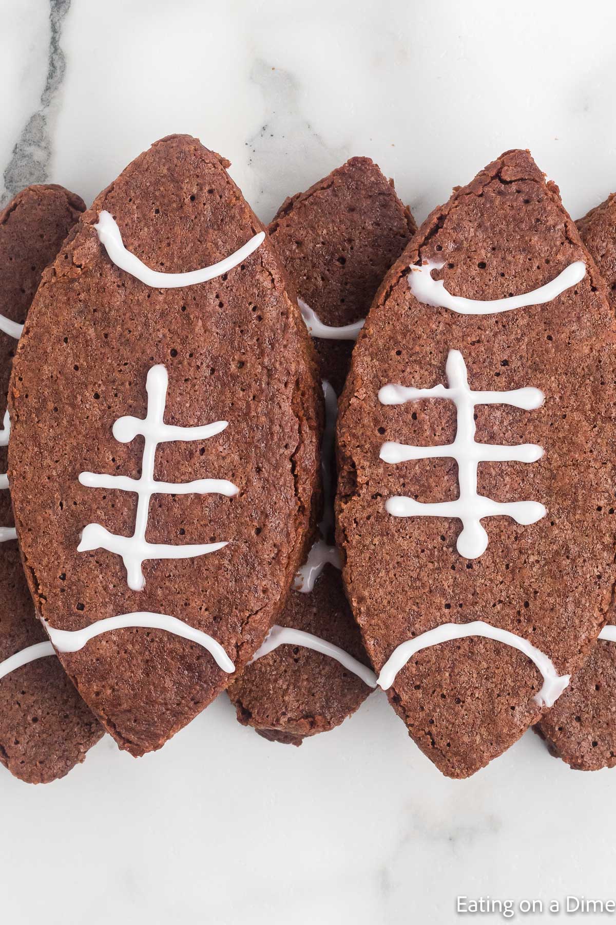 Football brownies stacked on a platter