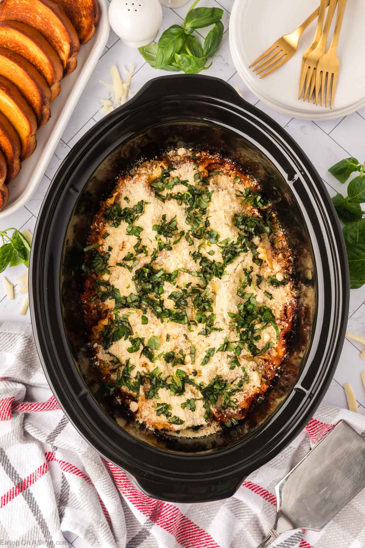 Slow Cooker Lasagna topped with fresh basil