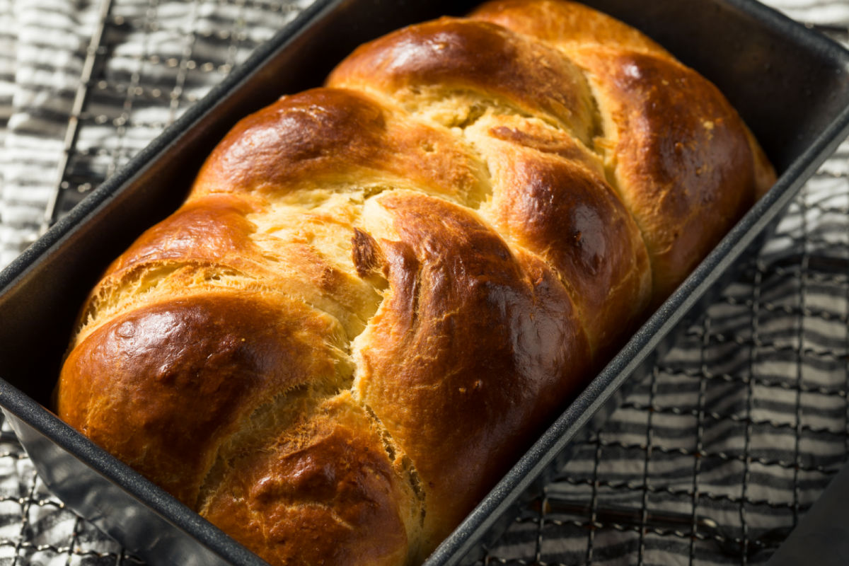 Close up image of brioche bread in a loaf pan