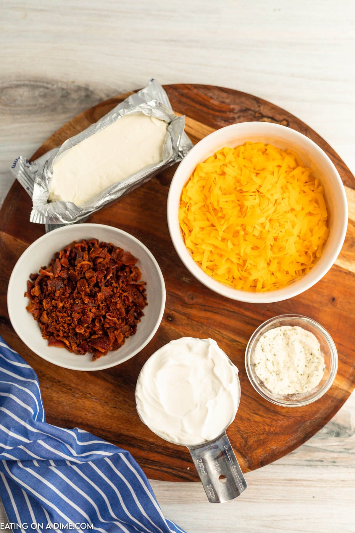 Ingredients for Bacon Cheddar Dip - cheese, bacon, cream cheese, sour cream and ranch seasoning. 