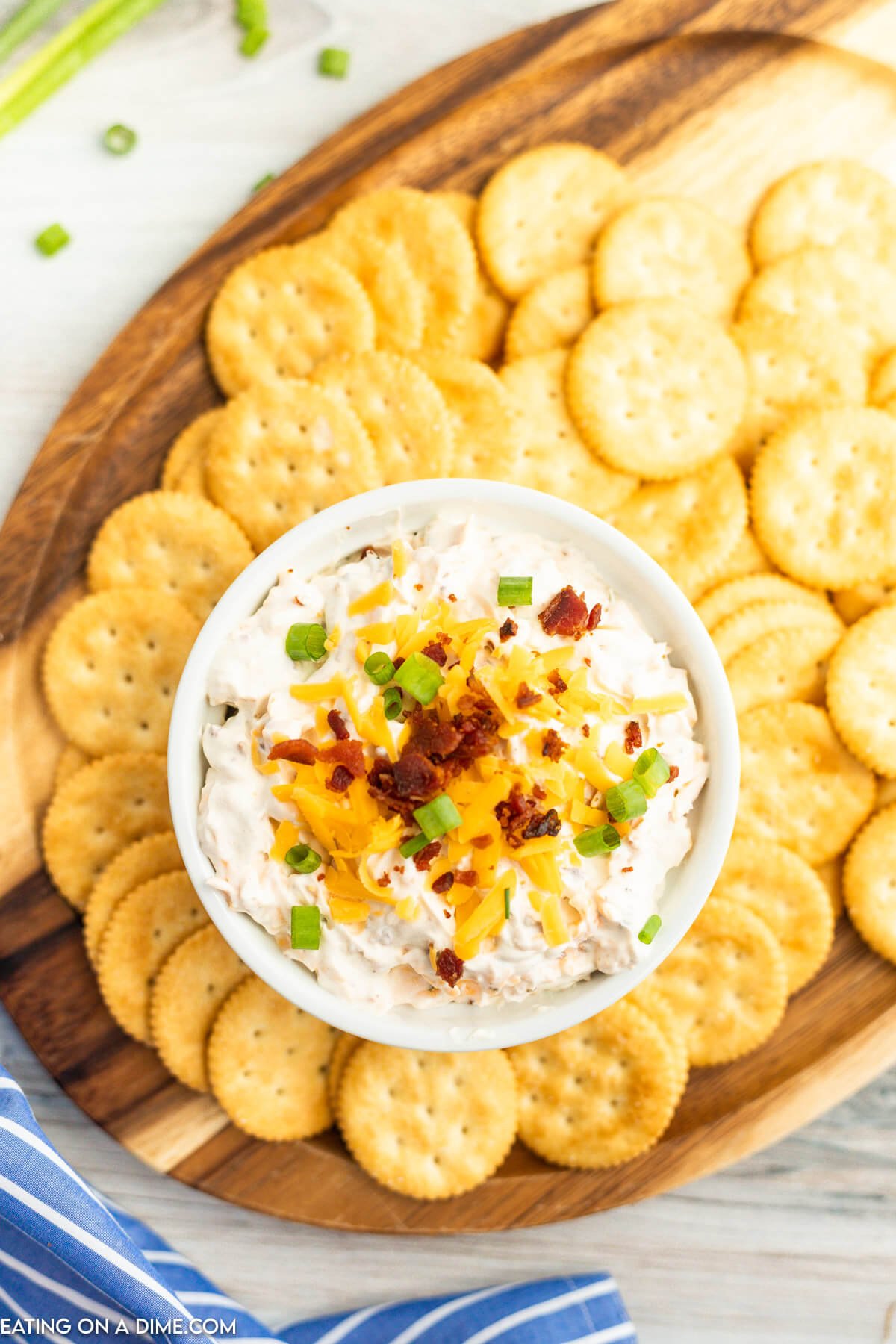 Bacon Cheddar Dip in serving bowl surrounded by crackers for dipping. 