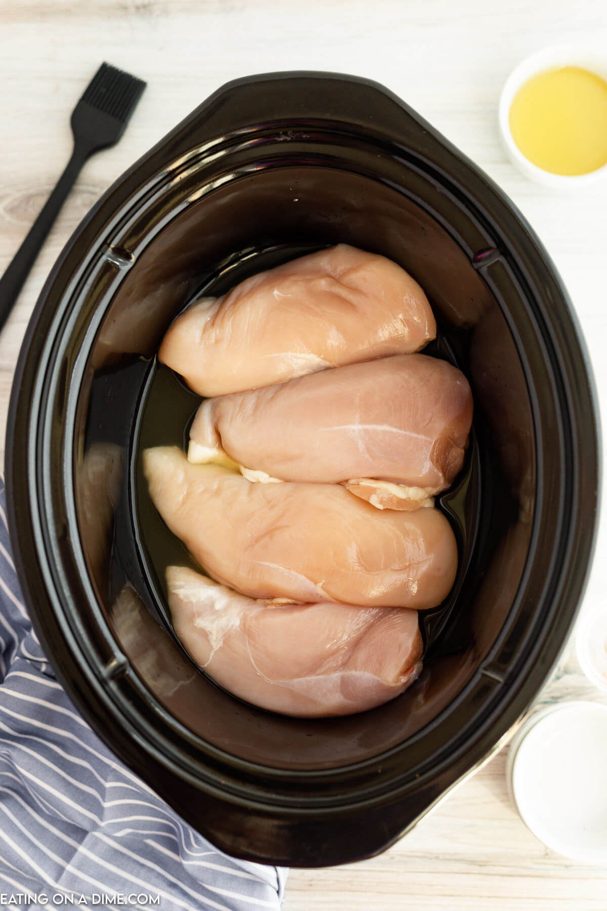 Placing chicken in the slow cooker