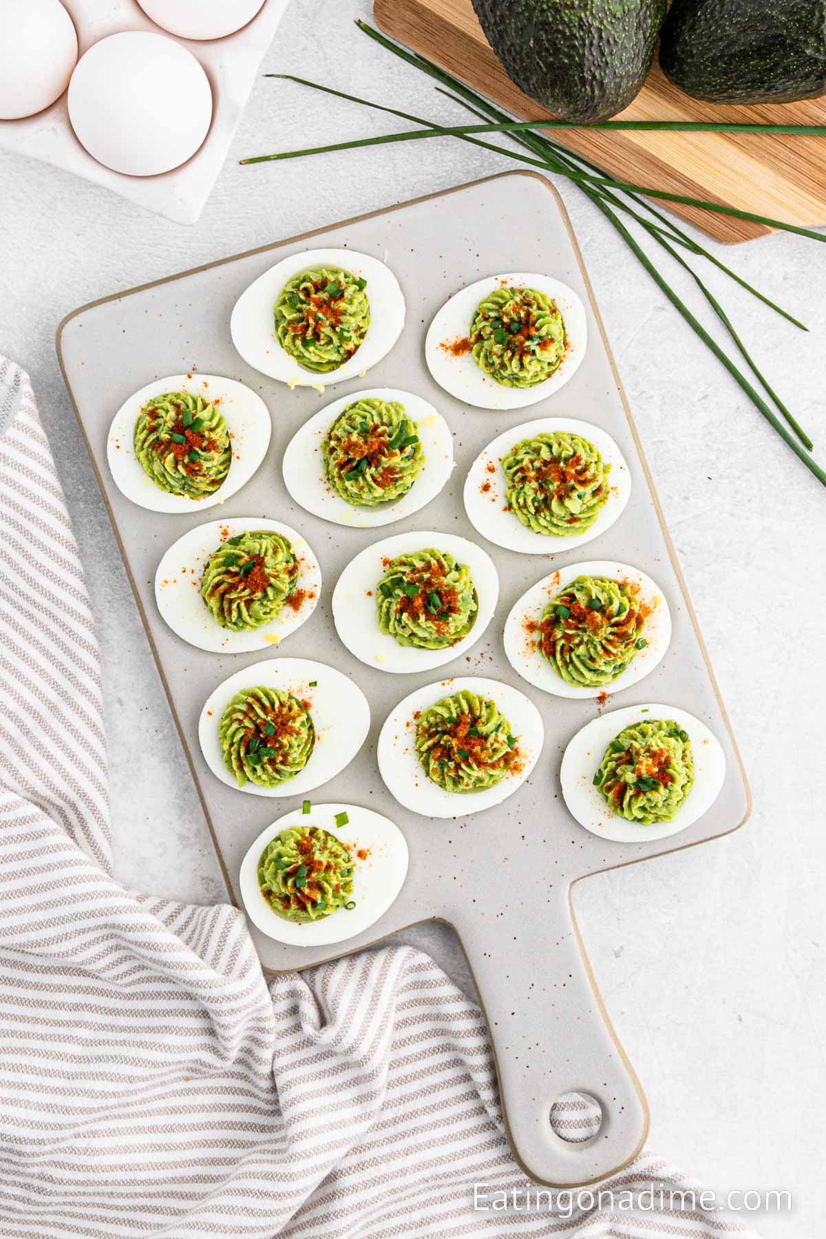 Avocado Deviled Eggs stacked on a platter