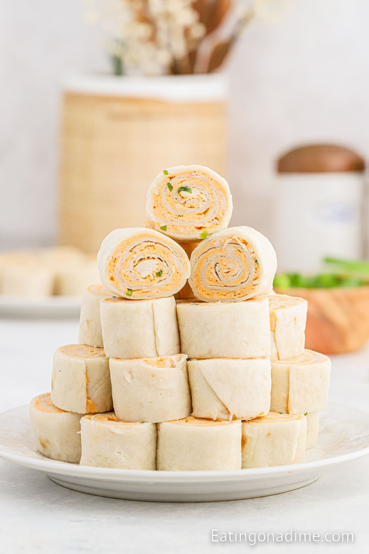 Buffalo Chicken Pinwheels stacked on a plate