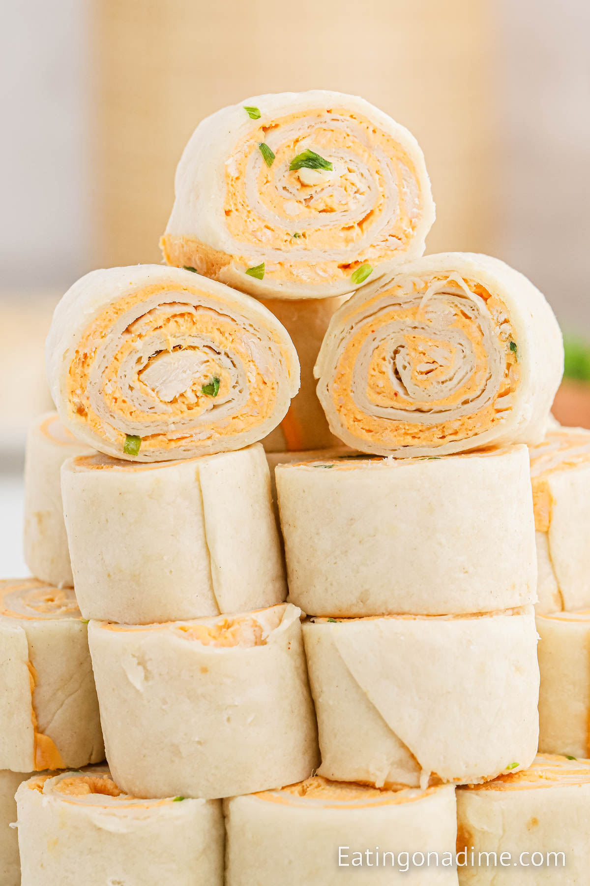 Buffalo Chicken Pinwheels stacked on a plate